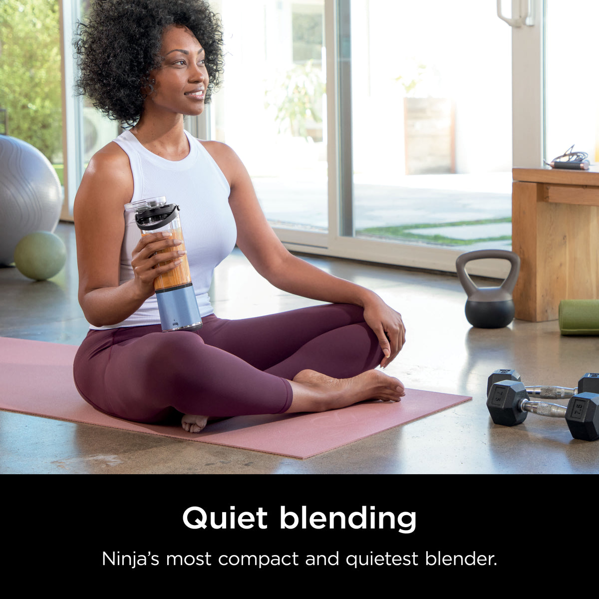 Ninja BC151BM portable blender in use