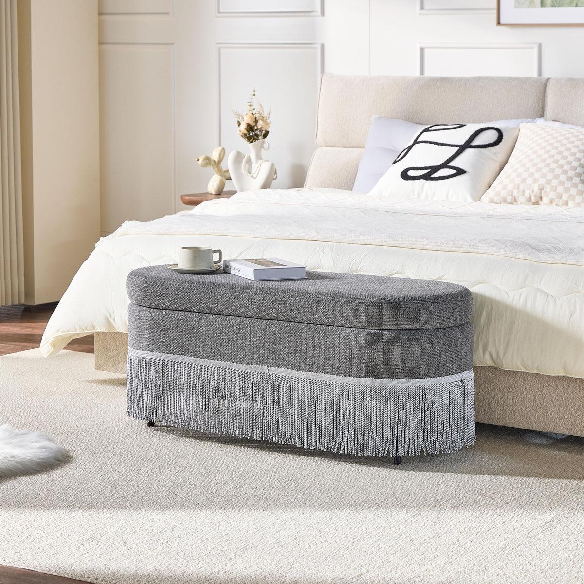 Oval Upholstered Storage Ottoman With Fringe Trim & Lift Top Lid