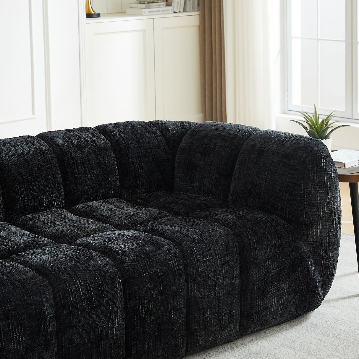 Quilted Cloud Sofa With Rounded Armrests And Piano Key Backrest Design