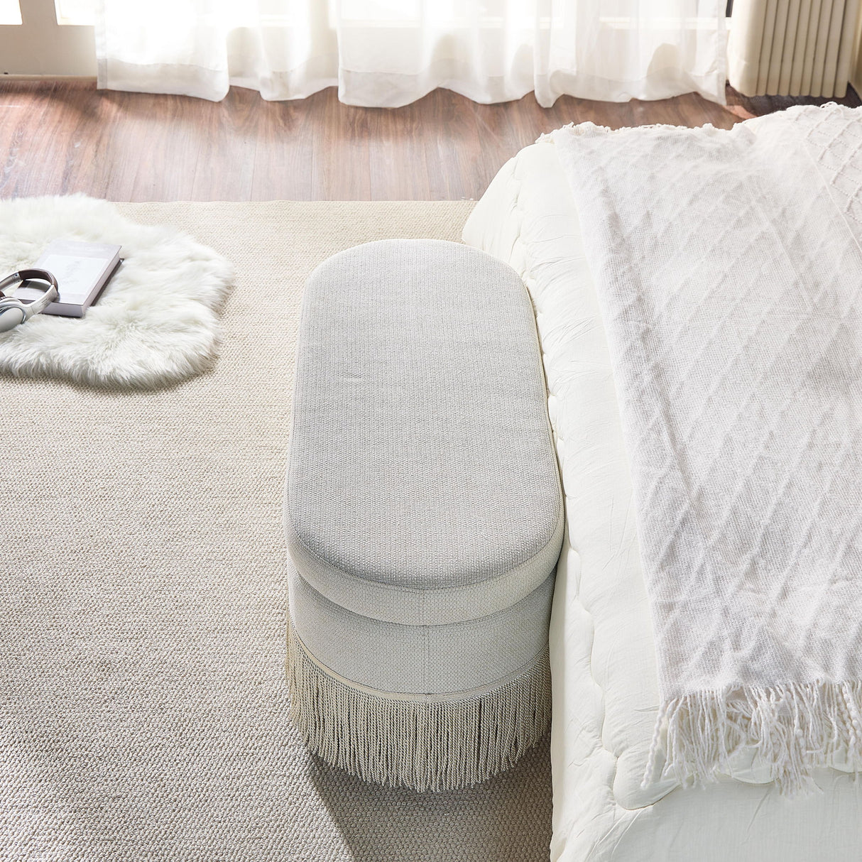 Oval Upholstered Storage Ottoman With Fringe Trim & Lift Top Lid