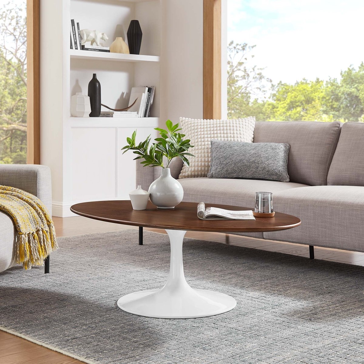 Oval Wood Pedestal Coffee Table - Coffee Tables available at Alpine Outlets in Denver