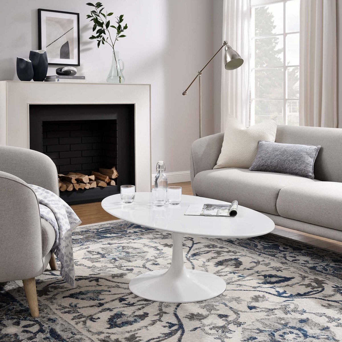Oval Wood Pedestal Coffee Table - Coffee Tables available at Alpine Outlets in Denver