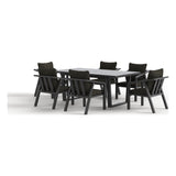 Rear three-quarter view of the Monarch seven-piece outdoor dining set in Charcoal