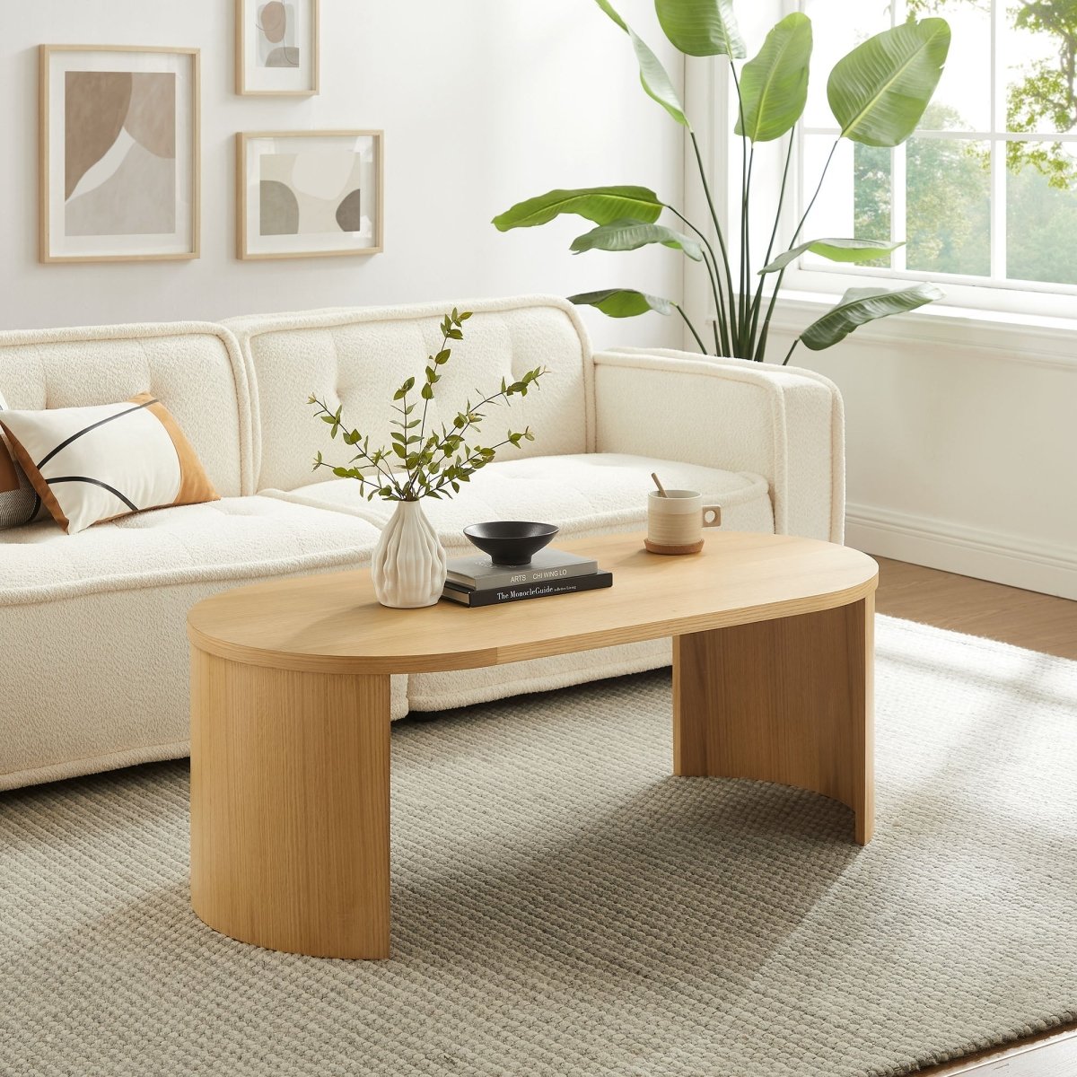 47 Inch Oval Wood Coffee Table with Reversible Arched Legs in Oak - Coffee Tables available at Alpine Outlets in Denver