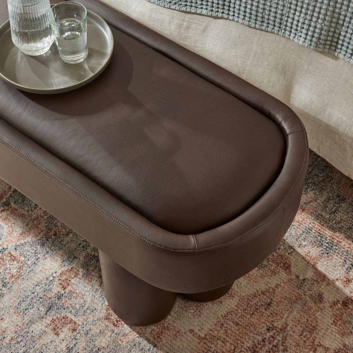 52 Inch Oval Vegan Leather Accent Bench with Sculptural Clover - Base Legs - Benches available at Alpine Outlets in Denver