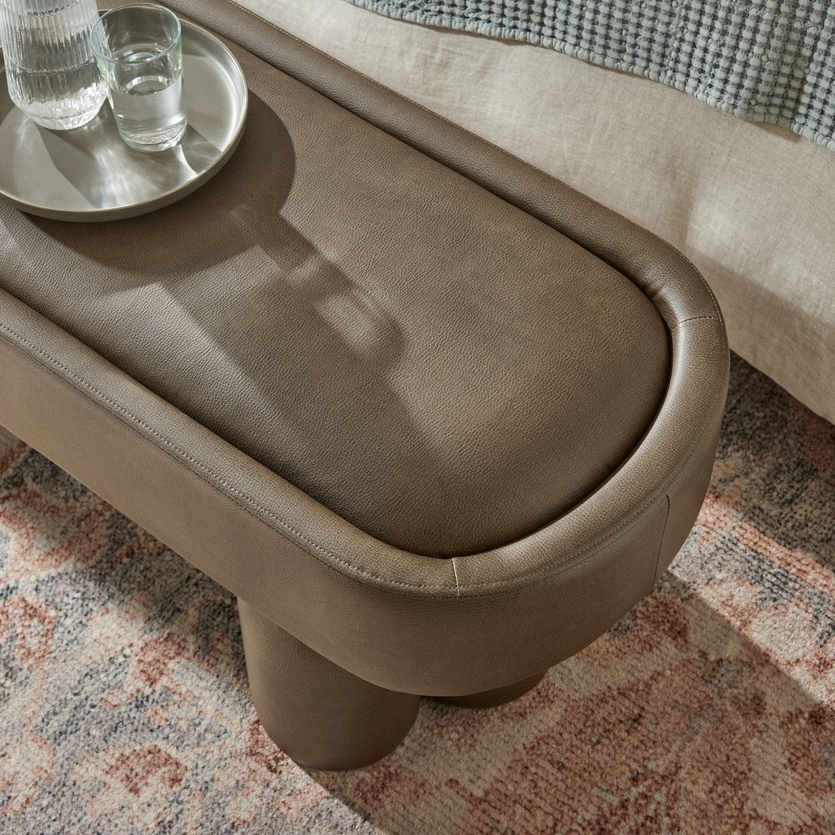 52 Inch Oval Vegan Leather Accent Bench with Sculptural Clover - Base Legs - Benches available at Alpine Outlets in Denver