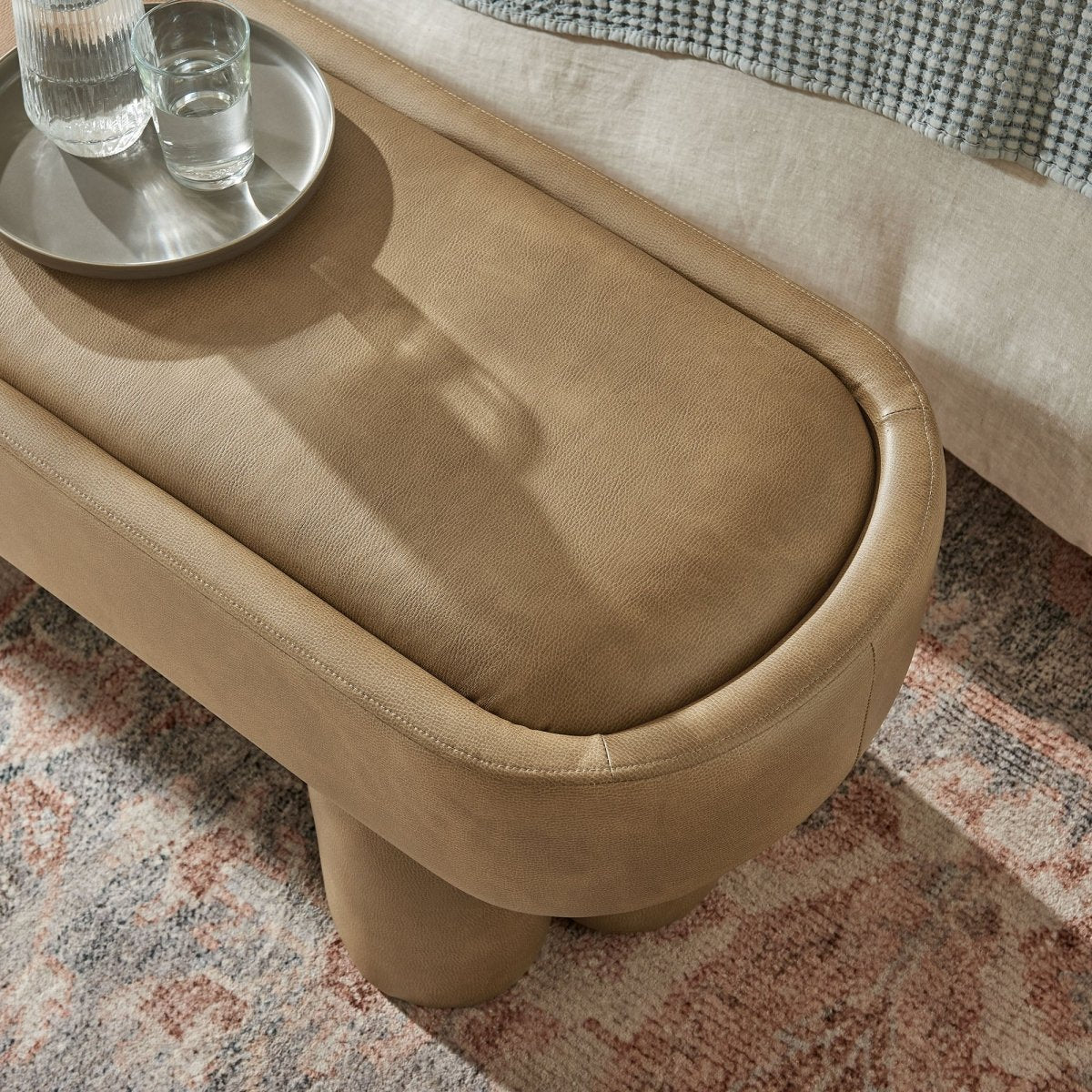 52 Inch Oval Vegan Leather Accent Bench with Sculptural Clover - Base Legs - Benches available at Alpine Outlets in Denver