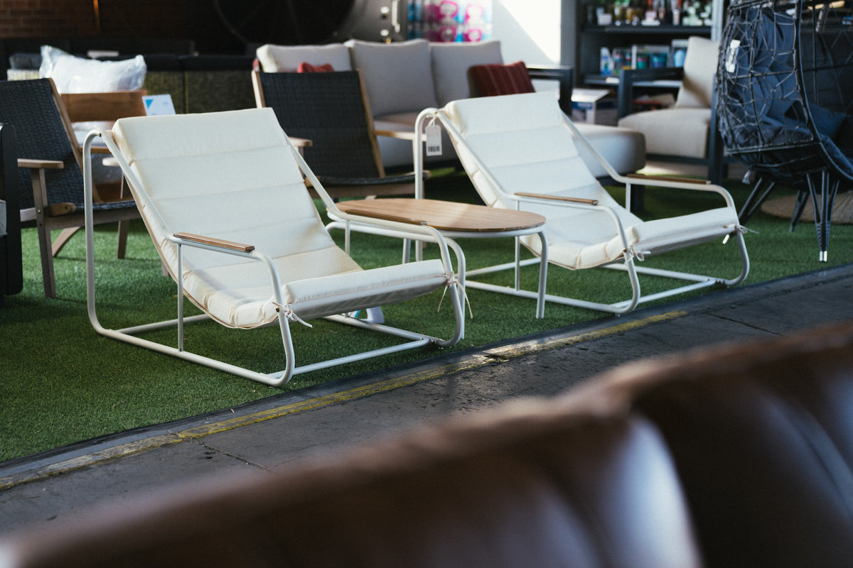 Patio lounge chairs on the showroom floor at Alpine Outlets Denver