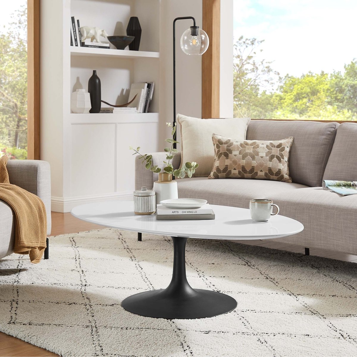 Oval Wood Pedestal Coffee Table - Coffee Tables available at Alpine Outlets in Denver