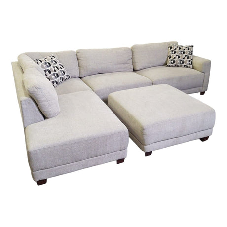 Raylin Fabric Sectional with Ottoman - available at Alpine Outlets in Denver